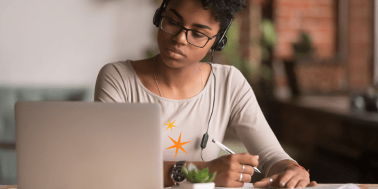 woman in office working on laptop